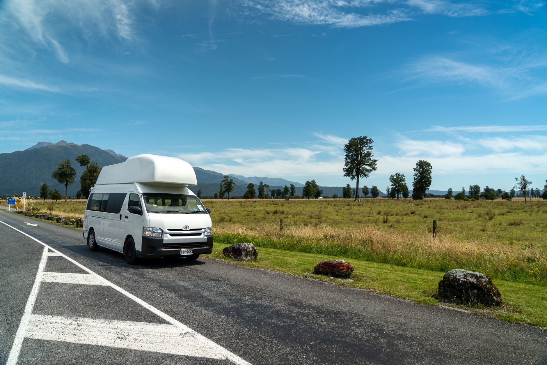 Campervan driving along New Zealand coast